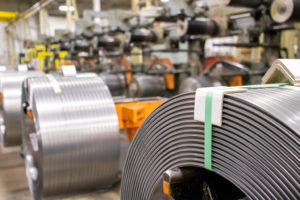 Rolls of high carbon steel on a manufacturing floor